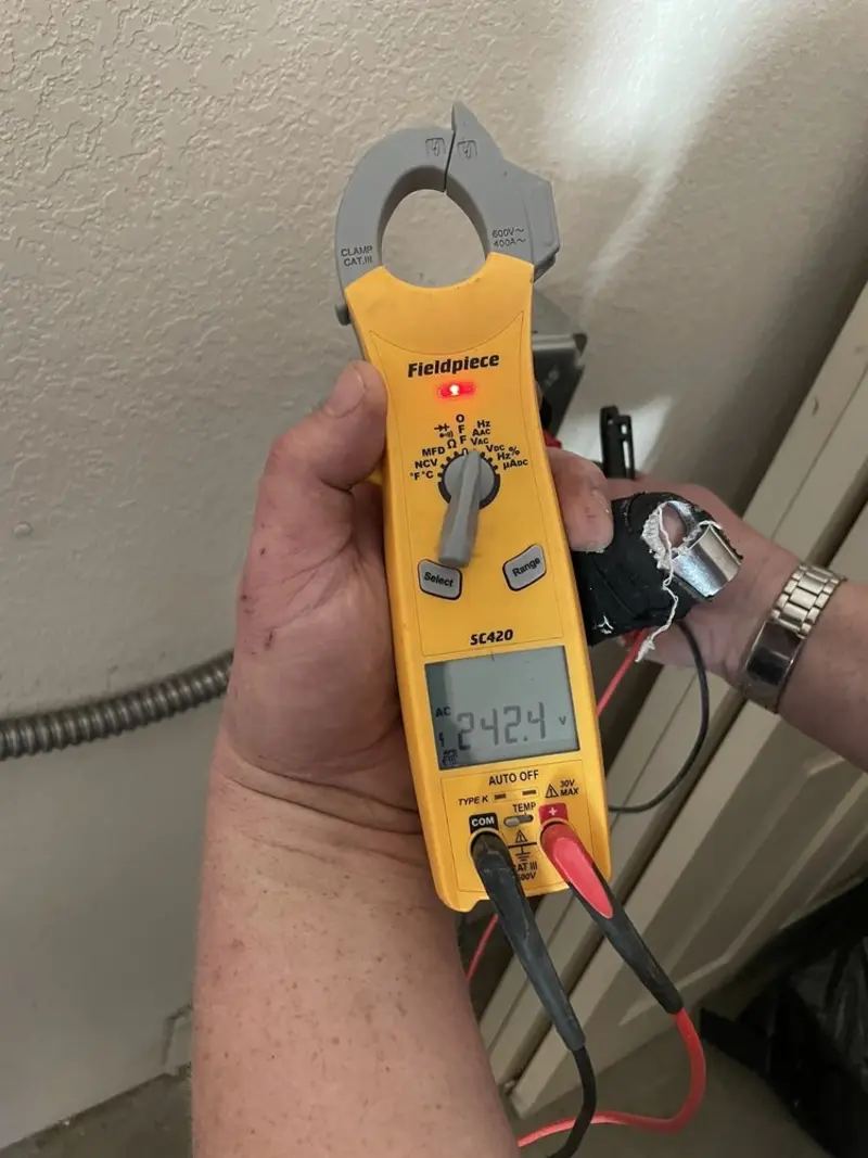 Voltage testing with clamp meter during Recessed Lighting Installation in Copake